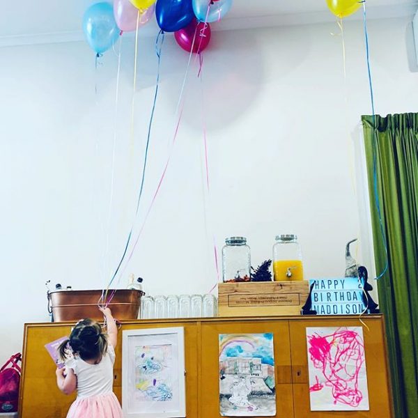 Child with Balloons